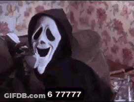 A Person Wearing A Scream Mask Is Sitting On A Couch With A Hoodie On . GIF