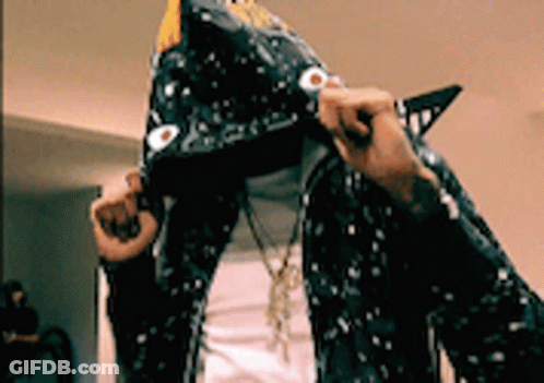 A Person Wearing A Shark Costume With A Hood GIF