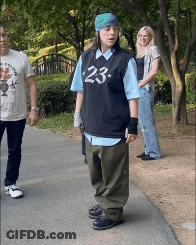 A Person Wearing A Shirt That Says 23 On It GIF