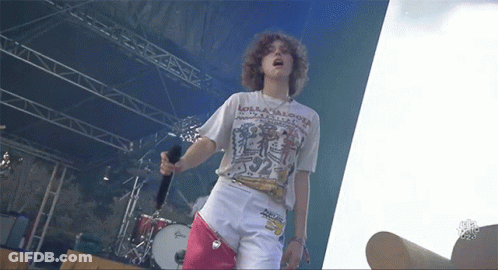 A Person Wearing A Shirt That Says Lollipops On It GIF