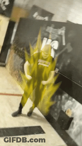 A Person Wearing A Shirt That Says ' Power ' On It Is Standing In Front Of A Wall GIF