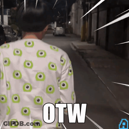 A Person Wearing A Shirt With Green Eyes And The Word Otw On The Back GIF