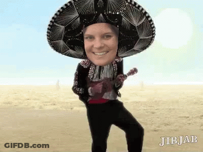 A Person Wearing A Sombrero And Holding An Ukulele . GIF