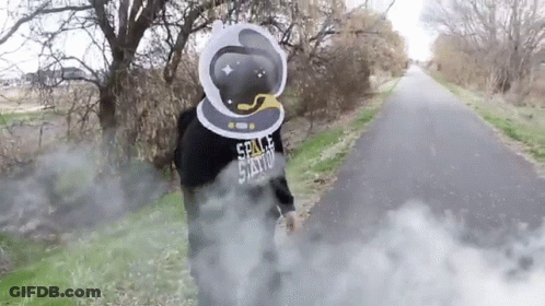 A Person Wearing A Space Station Hoodie Is Standing On A Road GIF