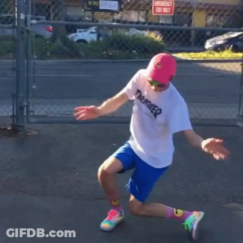A Person Wearing A Thrasher Shirt And Blue Shorts Is Dancing GIF