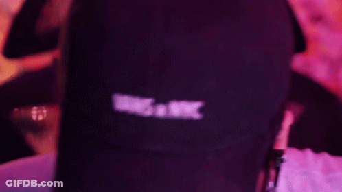 A Person Wearing A Vans X Nyc Hat And Headphones GIF