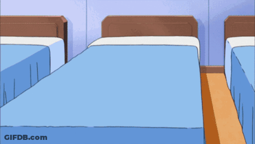 A Person Wearing A Watch With The Number 8 On It Is Standing Next To A Bed GIF