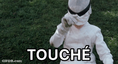 A Person Wearing A White Costume With The Word Touche Written On It GIF