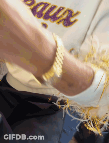 A Person Wearing A White Shirt With The Word Bruins Written On It GIF