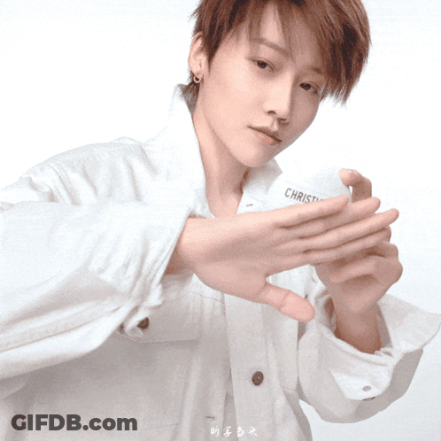A Person Wearing A White Shirt With The Word Christ On The Front GIF