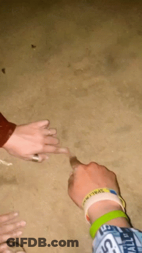 A Person Wearing A Wristband That Says " Space " On It GIF