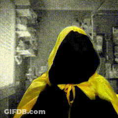 A Person Wearing A Yellow Cape With A Hood GIF