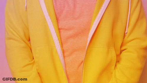 A Person Wearing A Yellow Hoodie With A Pink Shirt Underneath It GIF