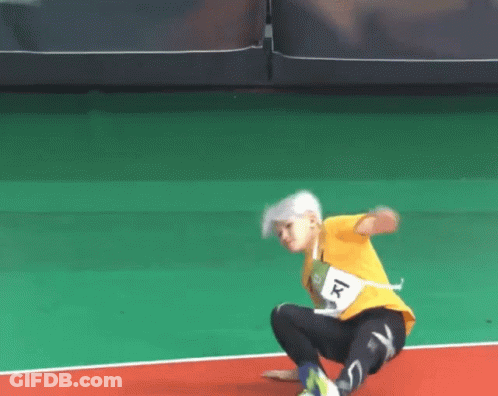 A Person Wearing A Yellow Shirt With The Number 1 On The Front GIF