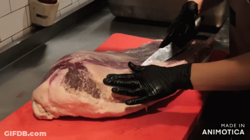 A Person Wearing Black Gloves Is Cutting A Large Piece Of Meat On A Red Cutting Board Made In Animotica GIF