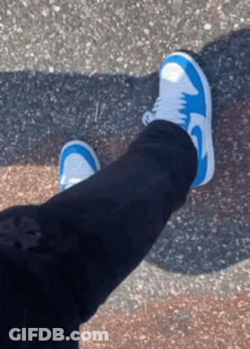 A Person Wearing Blue And White Nike Shoes GIF