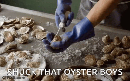 A Person Wearing Blue Gloves Is Cutting An Oyster With The Words " Shuck That Oyster Boys " Above Them GIF