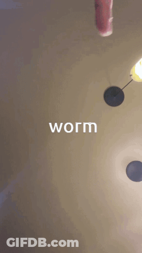 A Person Wearing Glasses With Their Mouth Open And The Word Worm Written Above Them GIF