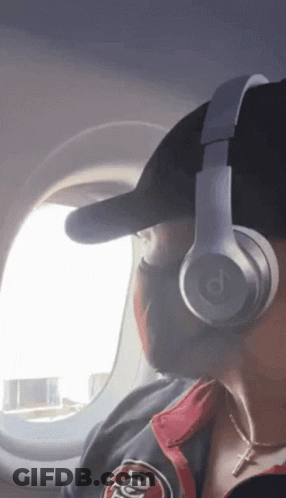 A Person Wearing Headphones And A 49Ers Jacket GIF