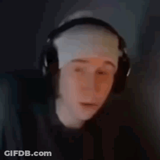 A Person Wearing Headphones And A Bandage On Their Head Is Looking At A Computer Screen . GIF
