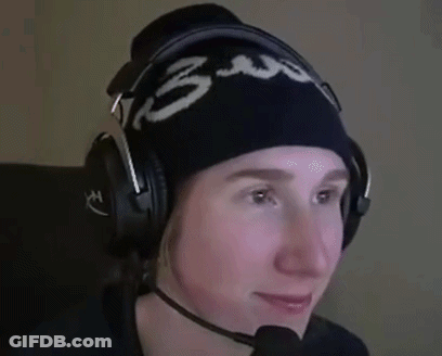 A Person Wearing Headphones And A Beanie With The Number 3 On It Is Smiling . GIF