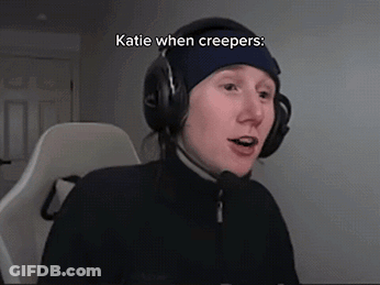 A Person Wearing Headphones And A Blue Hat With The Words Katie When Creepers On It GIF