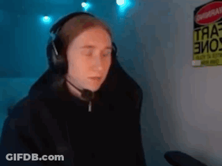 A Person Wearing Headphones And A Microphone Is Sitting In Front Of A Computer . GIF
