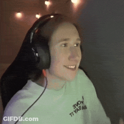 A Person Wearing Headphones And A White Shirt That Says Evoy GIF