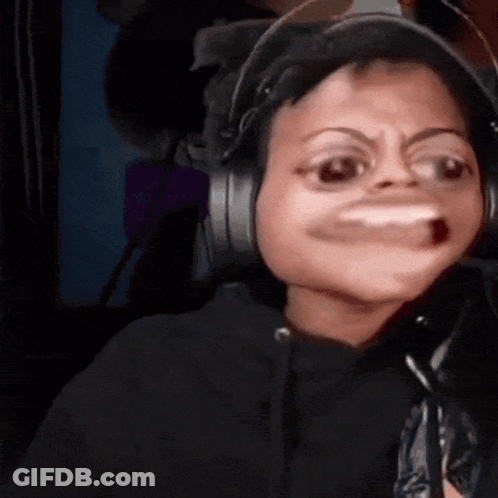 A Person Wearing Headphones Making A Funny Face With Their Mouth Open GIF