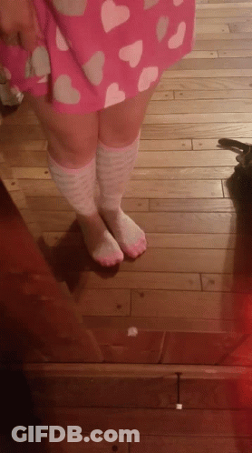 A Person Wearing Pink And White Knee High Socks GIF