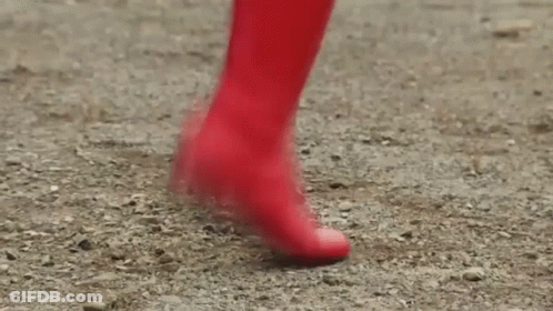 Person In Red Boots Walking On Dirt Path GIF