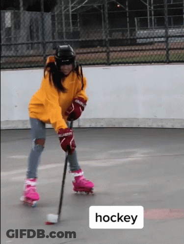 A Person Wearing Roller Skates And Hockey Gloves GIF