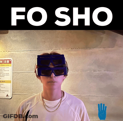 A Person Wearing Sunglasses And A Sign That Says N On It GIF