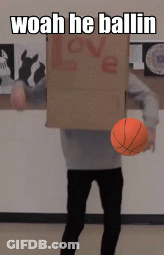 A Person With A Cardboard Box On Their Head Holding A Basketball And The Words Woah He Ballin Above Them GIF