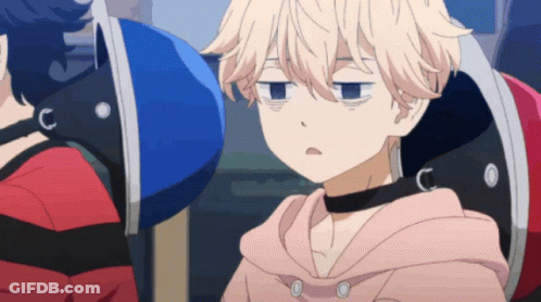 A Person With A Choker Around Their Neck Is Sitting In A Chair GIF