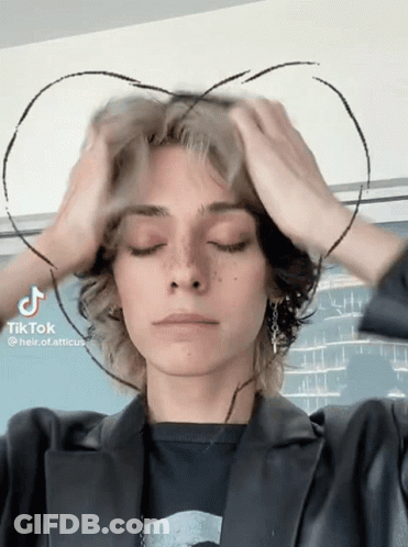 A Person With A Heart Drawn On Their Head Has Tiktok Written On The Bottom Right GIF