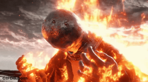 A Person With A Helmet On Their Head Is Surrounded By Flames GIF