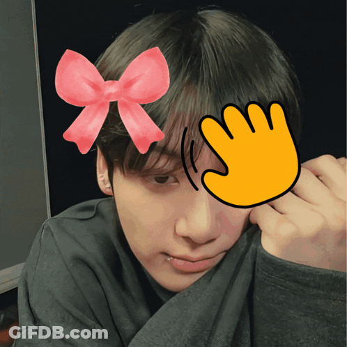 A Person With A Pink Bow On Their Head And A Yellow Hand Covering Their Face GIF