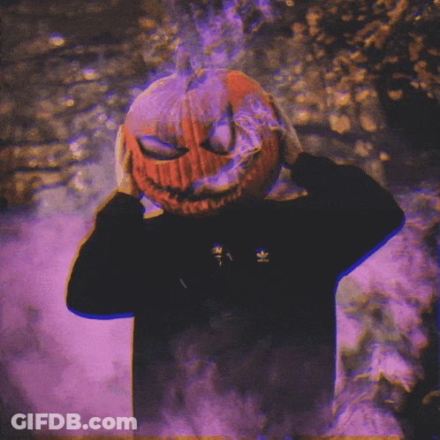 A Person With A Pumpkin On Their Head With Smoke Coming Out Of It 'S Eyes GIF