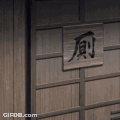 A Person With A Purple Heart Around Their Neck . GIF