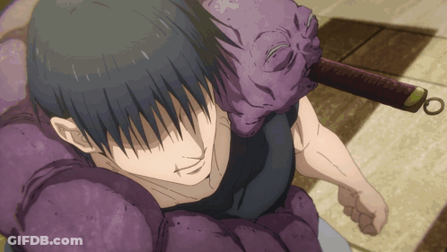 A Person With A Purple Mask On Their Head Holding A Sword GIF