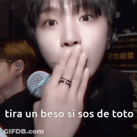 A Person With A Ring On Their Finger Is Covering Their Mouth With Their Hand GIF