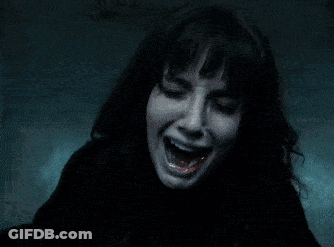 A Person With A Ring On Their Finger Is Holding A Black Object GIF