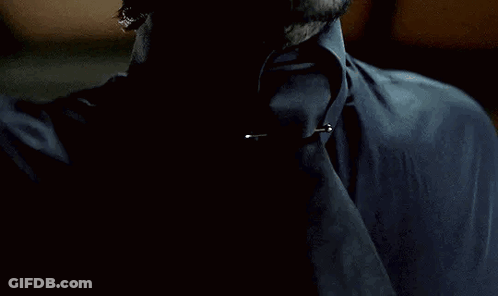 A Person With A Ring On Their Finger Is Holding Something GIF