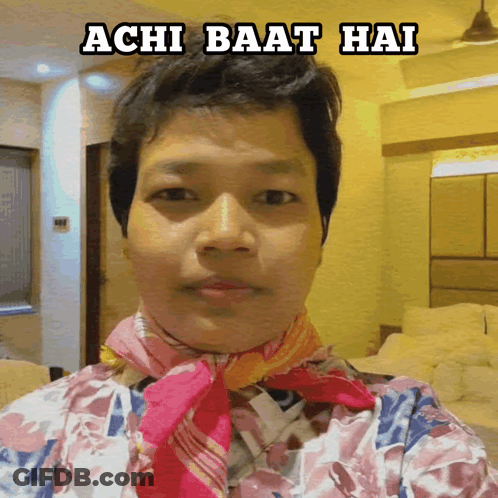A Person With A Scarf Around Their Neck And The Words Achi Baat Hai Above Them GIF