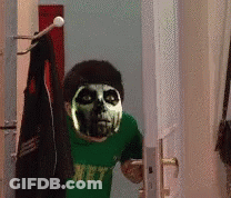 A Person With A Skeleton Mask On Their Face Is Wearing A Green Shirt That Says Hpt GIF