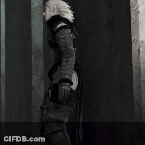A Person With A Tattoo On Their Arm Is Standing Next To A Wall GIF