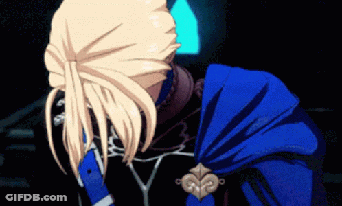 A Person With Blonde Hair And A Blue Cape GIF