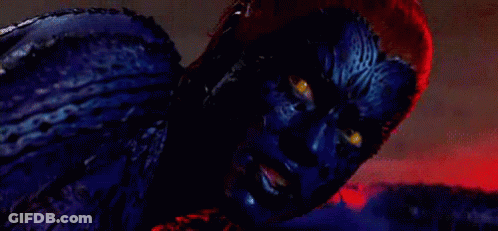 A Person With Blue Paint On Their Face And Yellow Eyes GIF