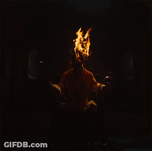 A Person With Flames Coming Out Of Their Head And A Crown On Their Head GIF